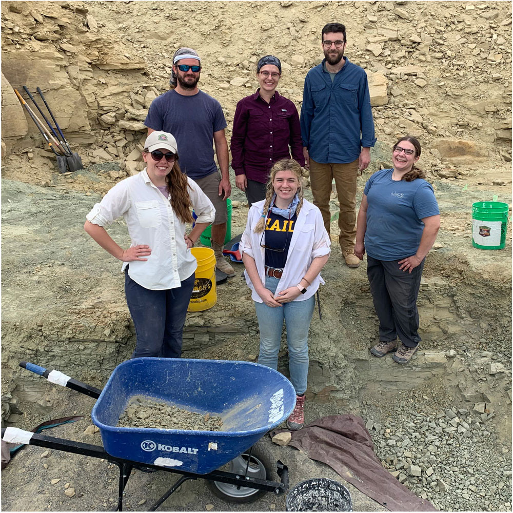 The first wave of the 2021 Mission Jurassic team standing in the Jurassic Mile dig site.